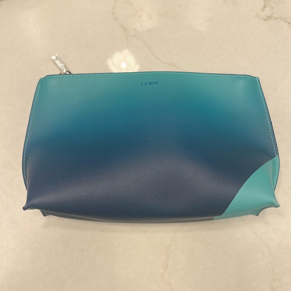 La mer makeup bag. New/ never used. Small white marks on back bottom corners